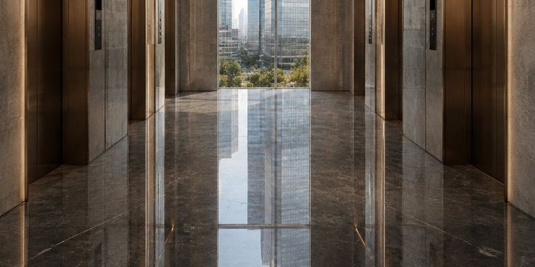 Polished granite lift lobby in a Dubai commercial tower
