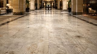 Restored granite floor surface with an even honed finish